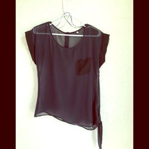 Sheer navy shortsleeved top with black trim.